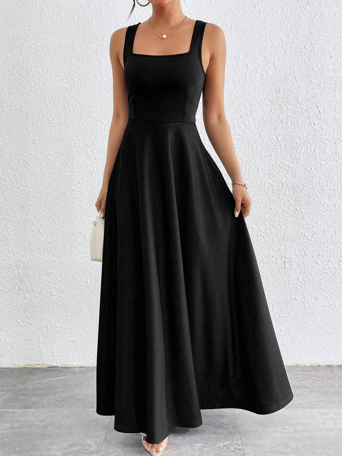 Black sleeveless square-neck long dress with fitted bodice and flared skirt