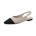 Two-tone woven pointed-toe slingback flats, beige body with black toe, flat thick sole