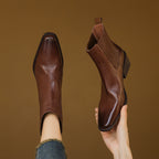 Brown square-toe Chelsea boots with side elastic gore and stacked block heel