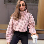 Pink polka dot cropped puffer jacket with stand collar and full zip front