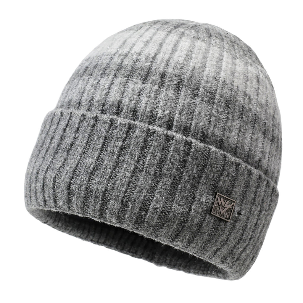 Striped knit beanie in light gray with dark stripes and metal badge on cuff