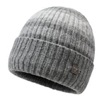 Striped knit beanie in light gray with dark stripes and metal badge on cuff