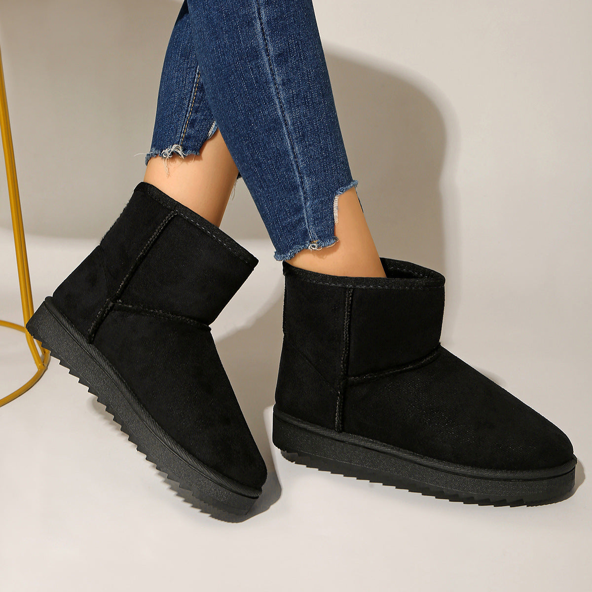 Black suede-look ankle boots with round toe, pull-on design and cushioned collar