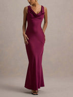 Burgundy satin maxi dress with sleeveless cowl neck and side draped seam.
