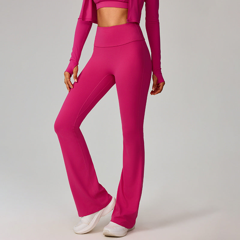 Hot pink high-waisted flare yoga leggings with clean seams and wide bootcut bottoms.