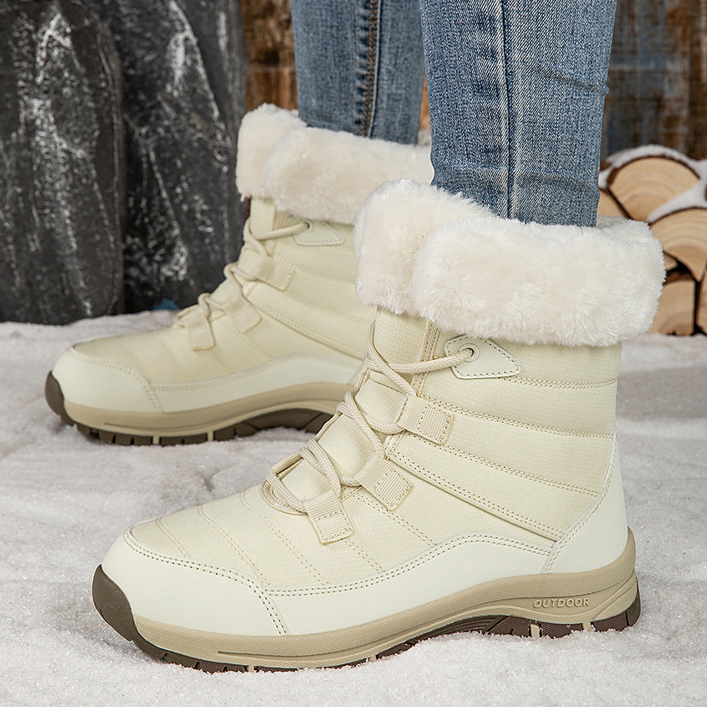 Women’s off-white lace-up snow boots with faux-fur cuffs and lug rubber sole