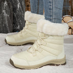 Women’s off-white lace-up snow boots with faux-fur cuffs and lug rubber sole