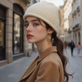 Women’s knitted beanie hat in cream beige, folded cuff and soft knit texture.