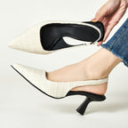 White tweed slingback pumps with pointed toe and flared heel, black interior