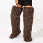 Dark brown shaggy thigh-high boots with a thick fur texture