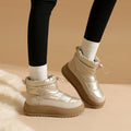 Light khaki snow boots with padded ankle collar, lace-up front, thick outsole