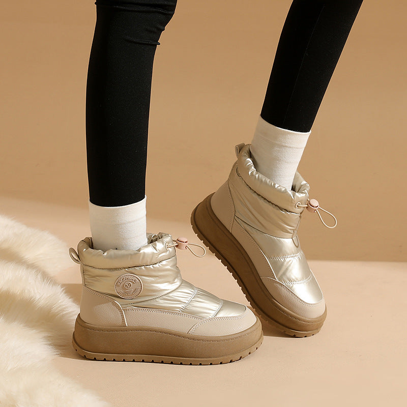 Light khaki snow boots with padded ankle collar, lace-up front, thick outsole