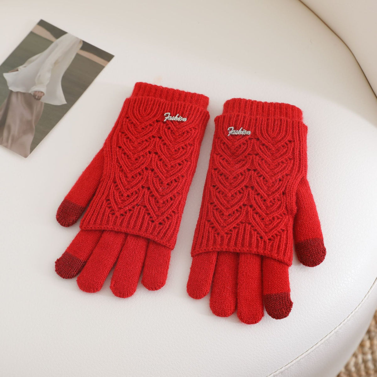Women’s red fingerless knit gloves with ribbed cuffs and textured wave pattern