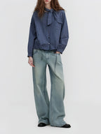 Dark blue plaid tie-neck button-up blouse with button front and balloon sleeves
