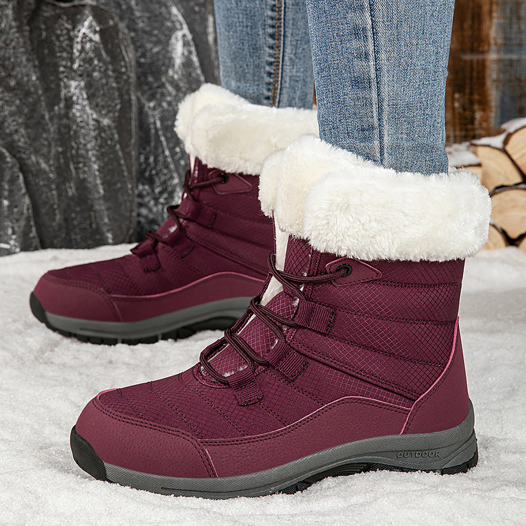 Women’s burgundy lace-up snow boots with faux-fur cuffs and lug rubber sole
