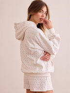Back/side view of white ditsy floral oversized hoodie with kangaroo pocket