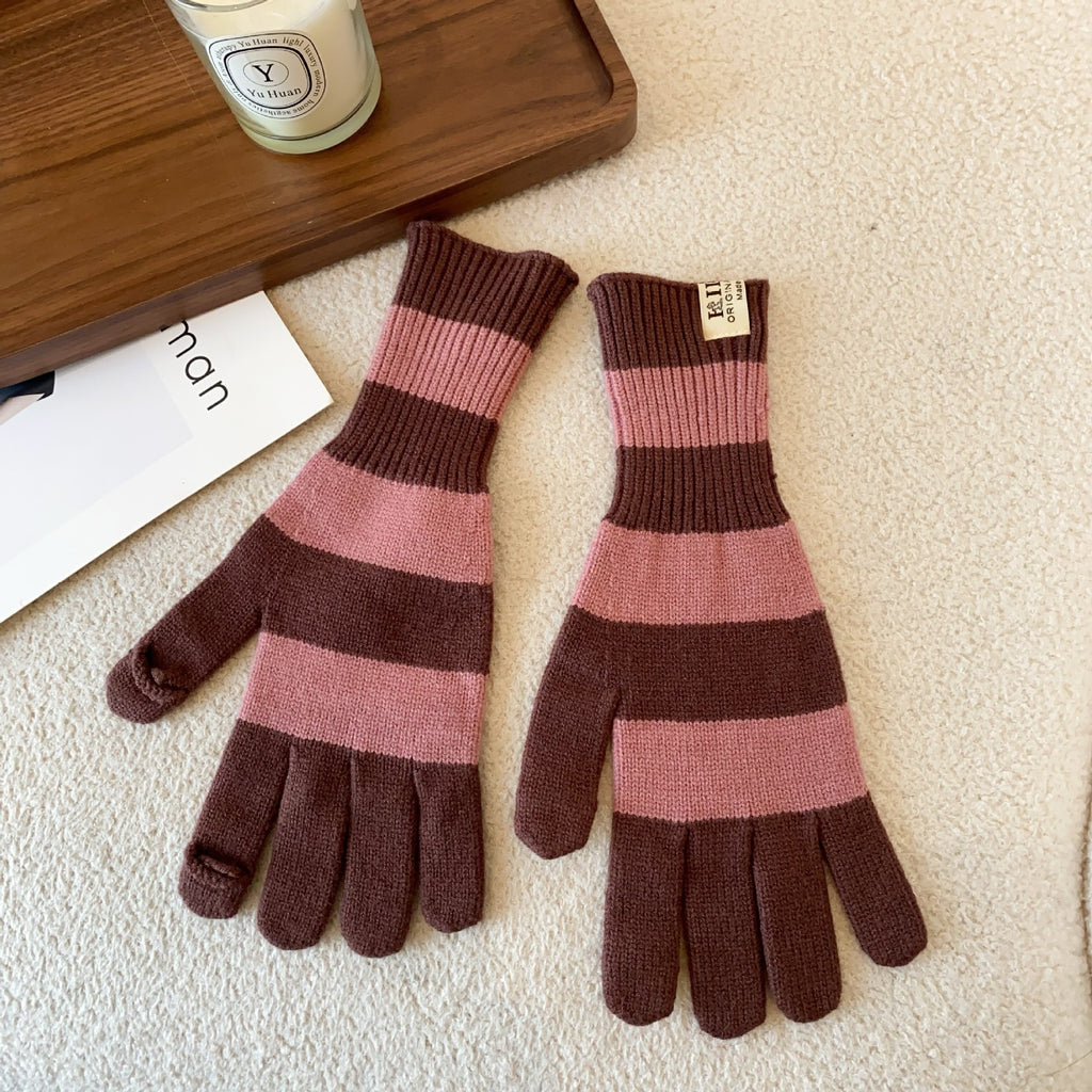 Women’s striped knit gloves in pink and brown with long ribbed cuffs and five-finger design