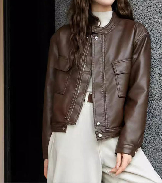 Cropped dark brown faux leather jacket with stand collar, zip front, flap pockets