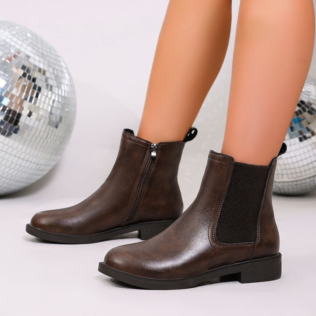 Brown chelsea boots with side zip, elastic side panels, low block heel, ankle height