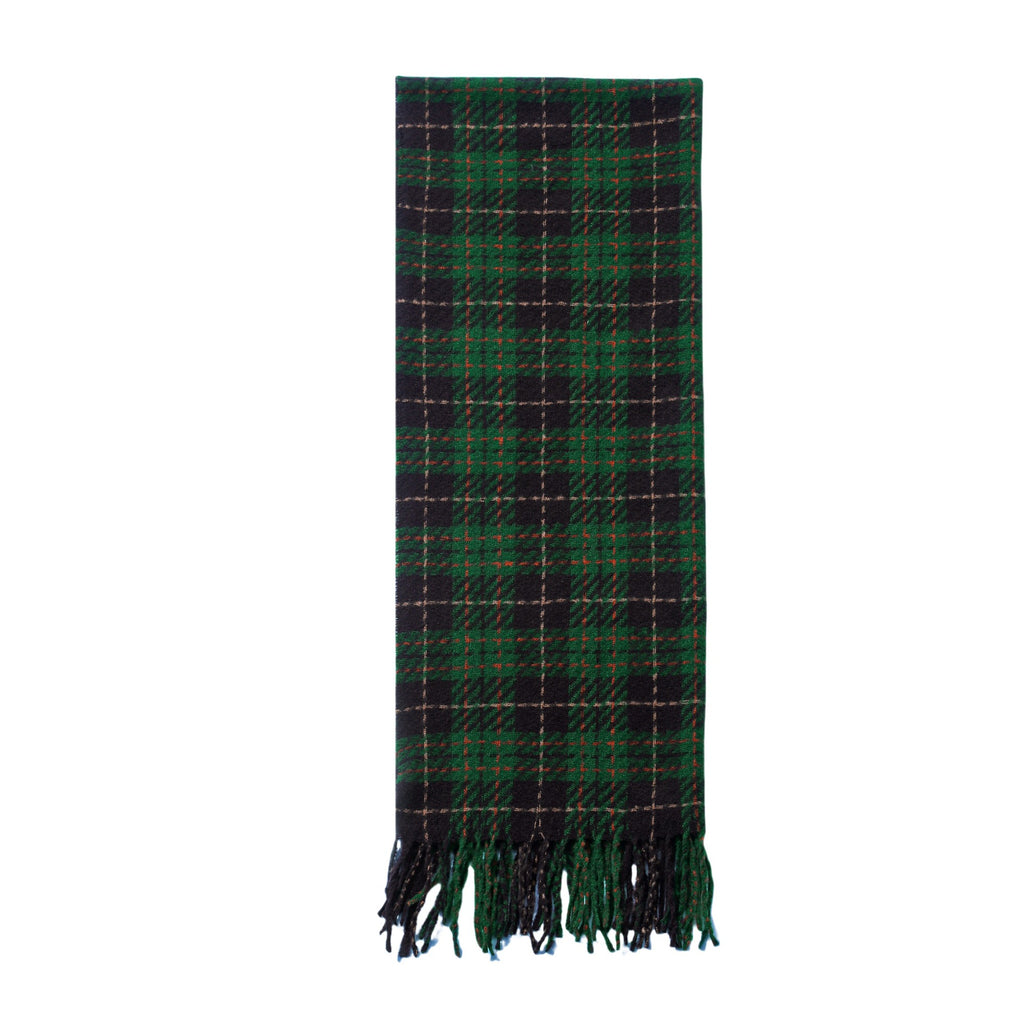 Green plaid scarf laid flat, with tassel fringe edges