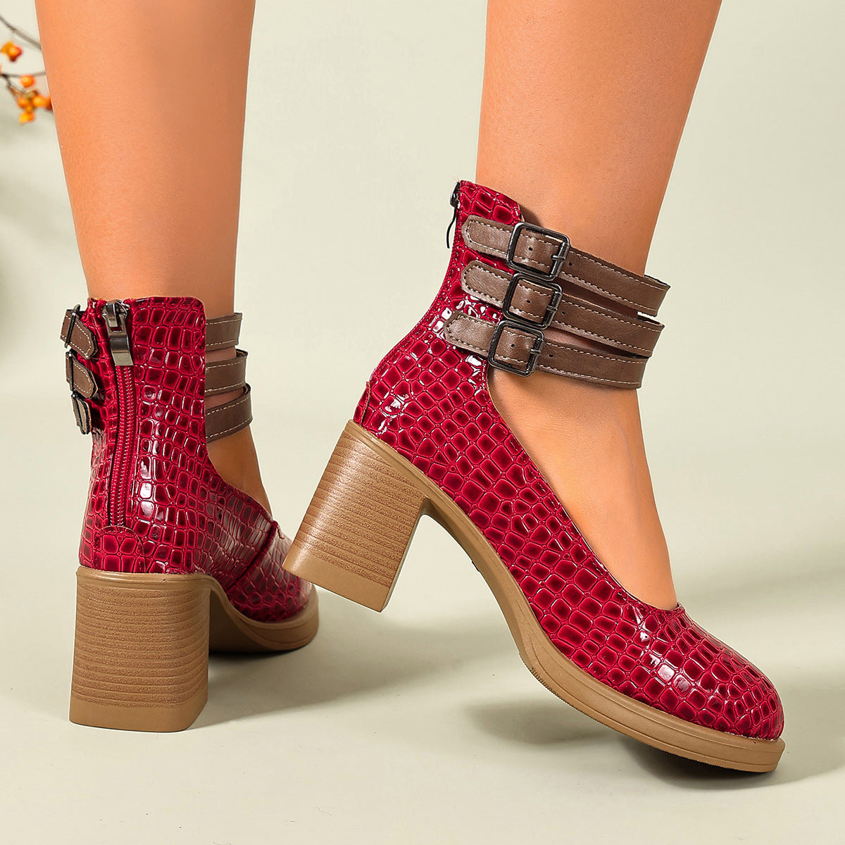 Red croc-embossed platform ankle strap pumps with block heels and triple buckle cuff