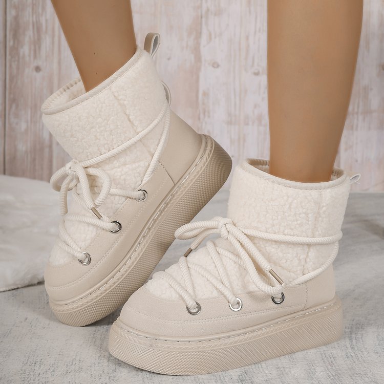 White sherpa lace-up snow boots with wrap laces and cushioned ankle cuff