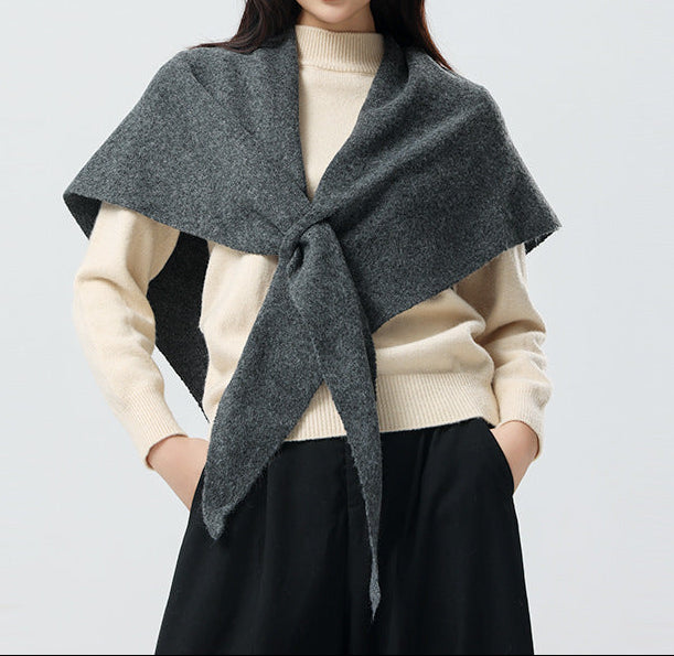 Women’s cashmere triangle scarf in dark gray, draped with center tie knot