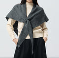 Women’s cashmere triangle scarf in dark gray, draped with center tie knot