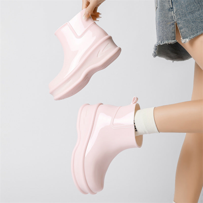 Women's light pink glossy ankle rain boots, chunky platform pull-on style