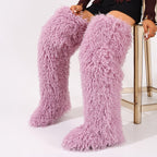Pink faux fur thigh-high boots with dense curls and rounded toes