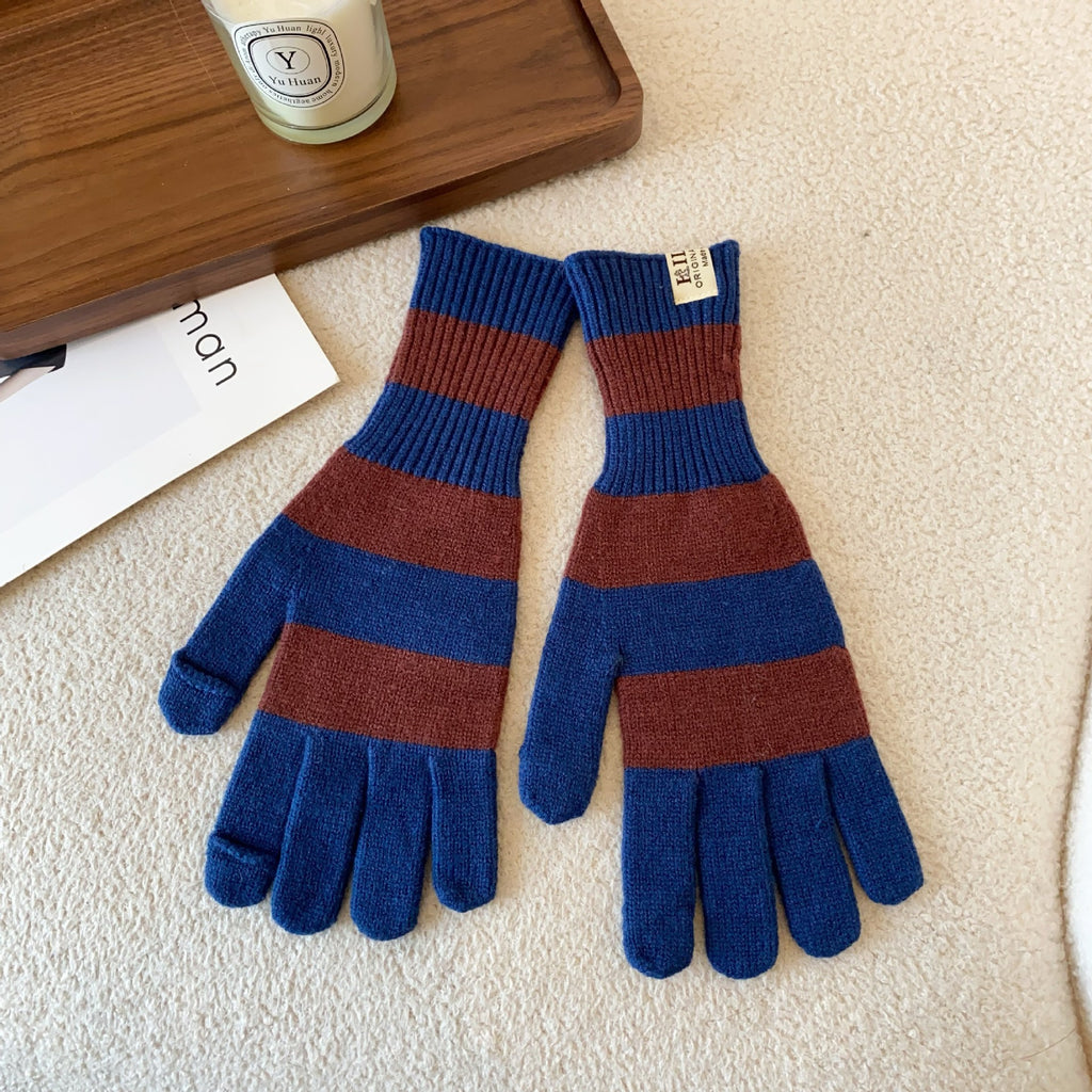 Women’s striped knit gloves in blue and brown with long ribbed cuffs and five-finger design