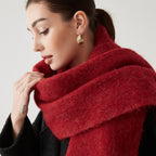 Oversized fuzzy wool-blend scarf in deep red, wide draped wrap around neck