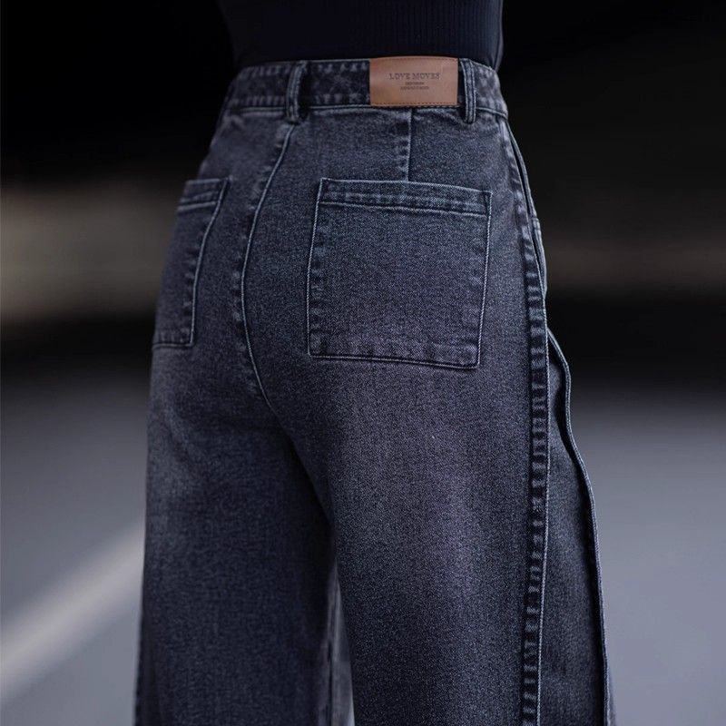 Black high-waisted wide-leg jeans with back patch pocket and stitched side seam