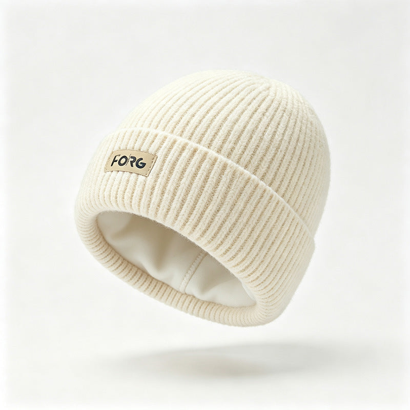 Cream ribbed knit beanie with fleece lining and FORG patch