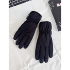 Black insulated ski gloves with padded nylon and knuckle seam detail