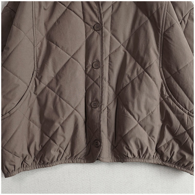 Women’s quilted hooded jacket detail, taupe diamond stitching with button front