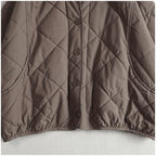 Women’s quilted hooded jacket detail, taupe diamond stitching with button front