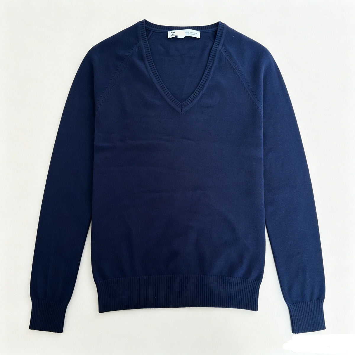 Women’s dark navy V-neck fine-knit sweater with long sleeves and ribbed hem