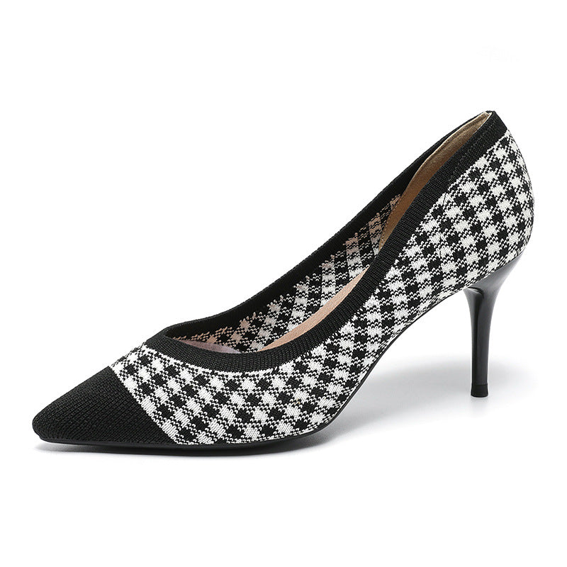 Women’s black and white houndstooth knit stiletto pumps with pointed toe.