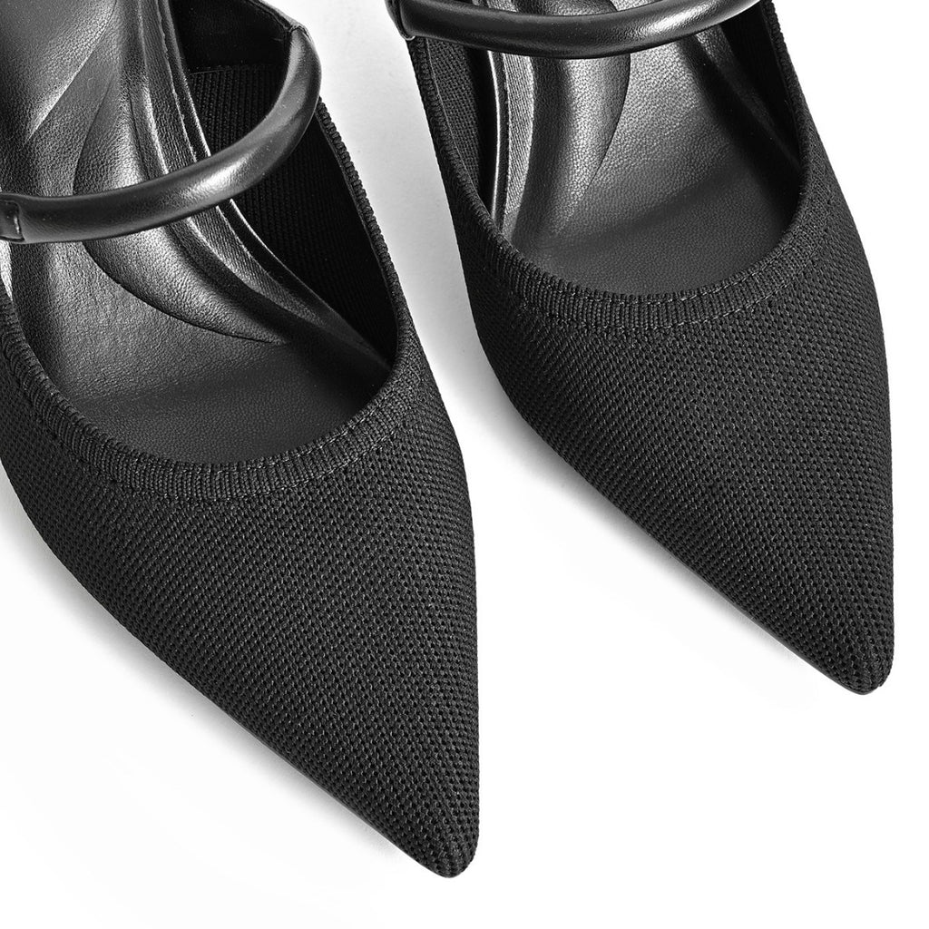 Close-up of black knit pointed-toe mule with buckle strap and stiletto heel