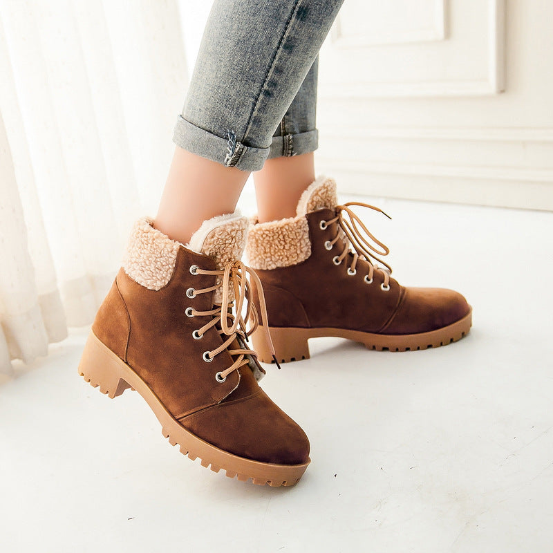 Brown lace-up boots with sherpa cuffs and block heels