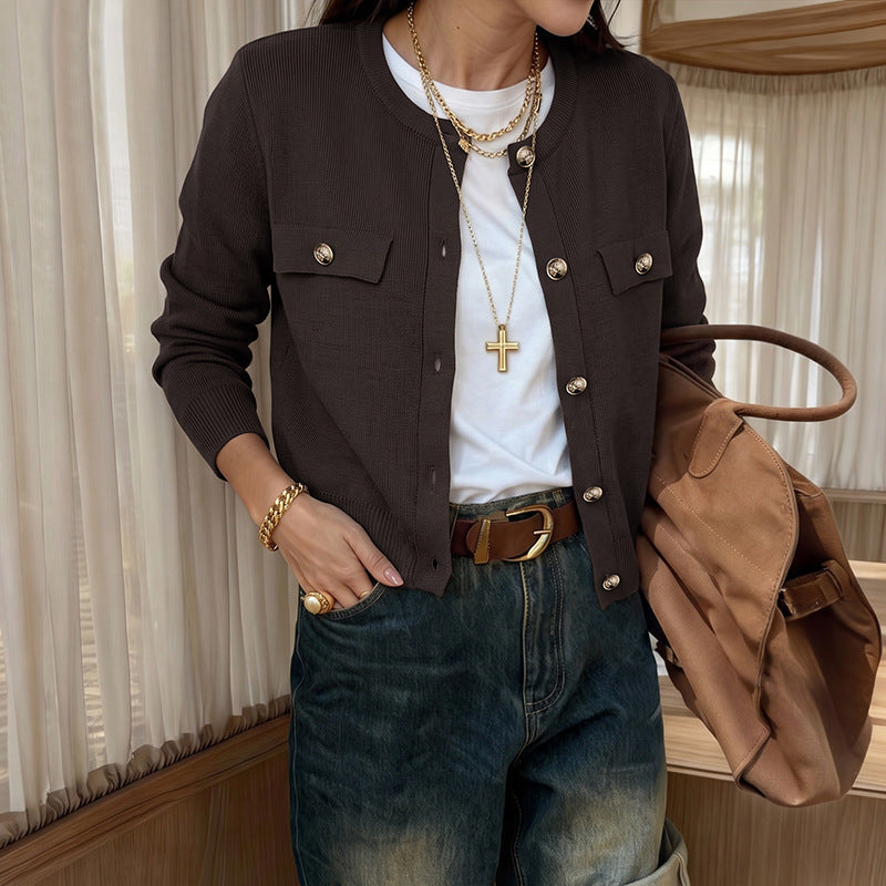 Dark brown crew-neck cardigan with gold buttons and flap pockets, ribbed front hem