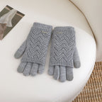 Women’s gray fingerless knit gloves with ribbed cuffs and textured wave pattern