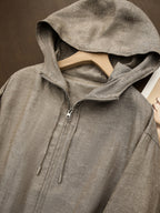 Taupe linen hooded zip-up jacket with drawstring hood and front zipper