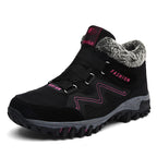 Black snow boots with faux fur lining, hook-and-loop straps, magenta accents, lug sole