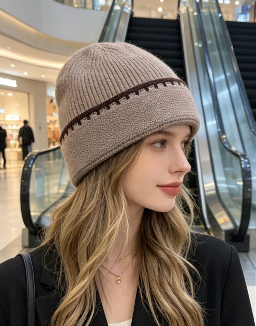 Ribbed knit beanie in taupe with dark contrast stitch stripe at the cuff.