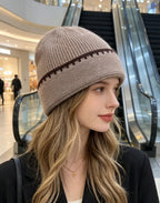 Ribbed knit beanie in taupe with dark contrast stitch stripe at the cuff.