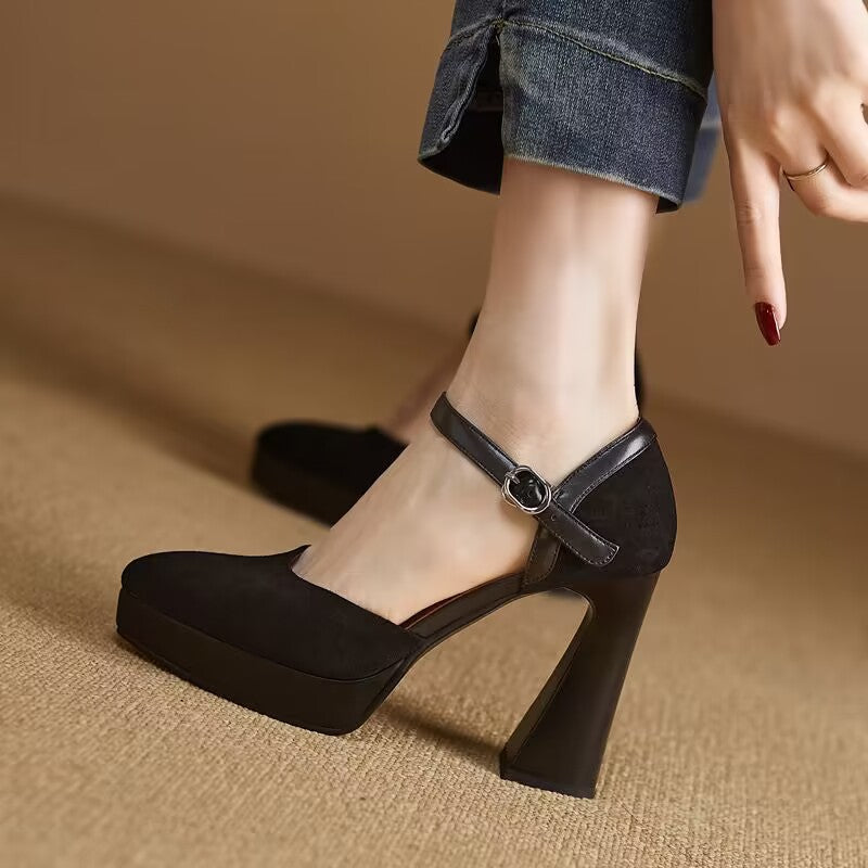 Black closed-toe platform pump with ankle buckle strap and thick block heel