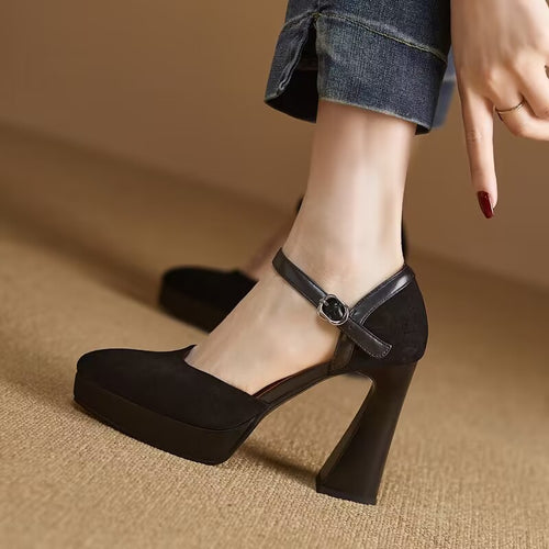 Black closed-toe platform pump with ankle buckle strap and thick block heel