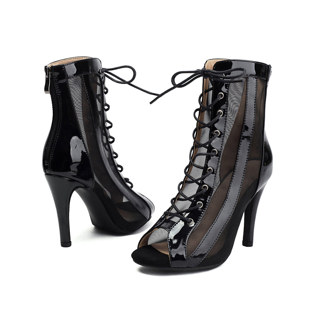Black peep-toe lace-up stiletto ankle booties with sheer side panels, pair view.